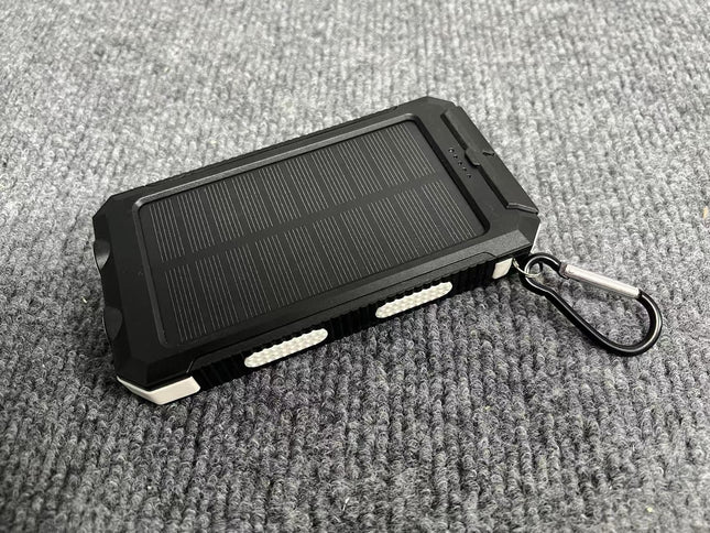 EcoCharge | Portable Solar Power Bank with Integrated Plug for Outdoor Adventures 0